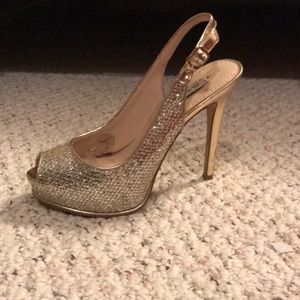 Gold high heel shoes